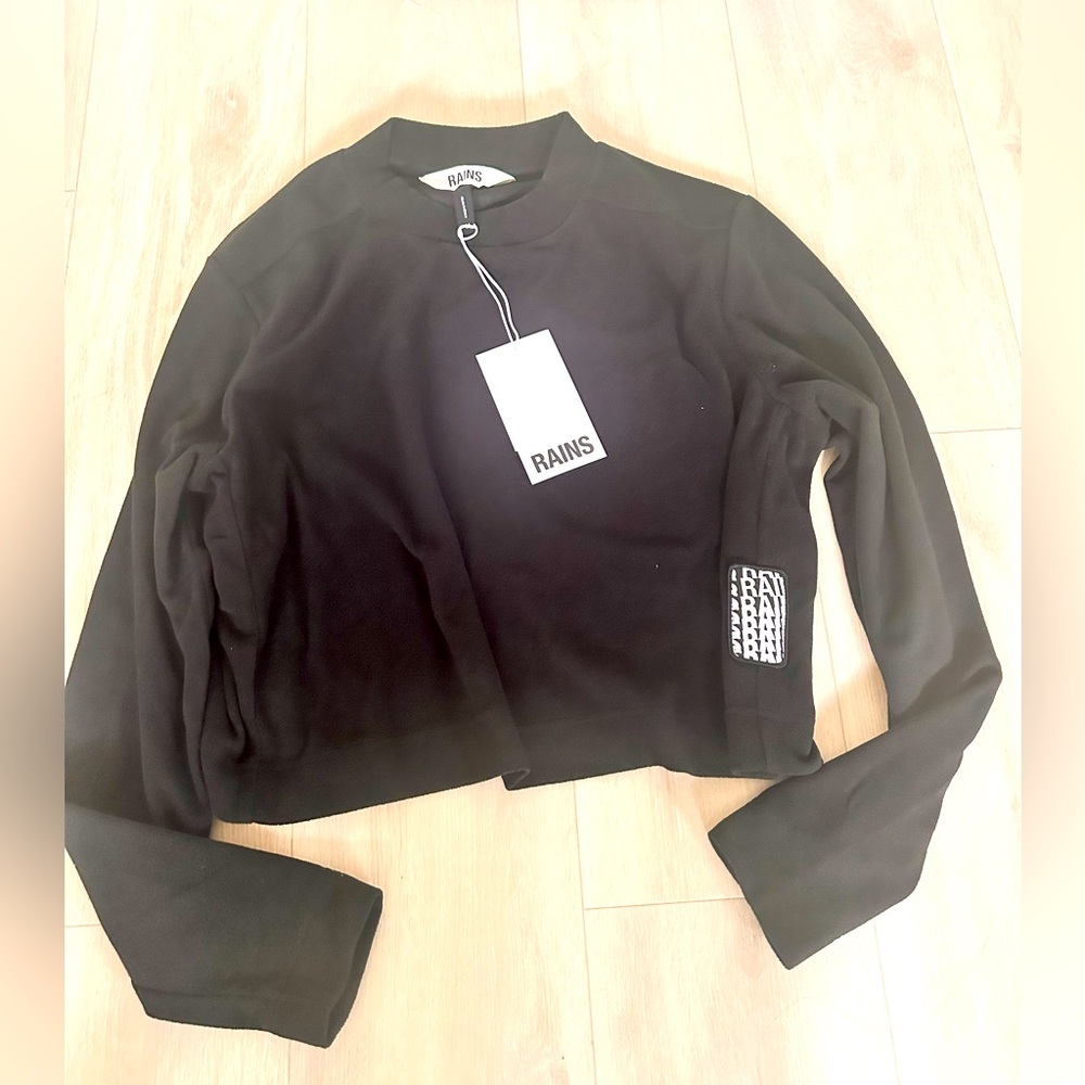 Brand new Rains fleece sweatshirt size M